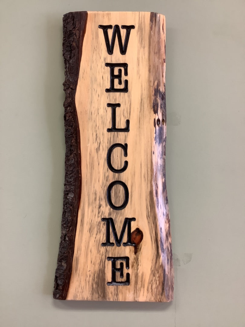 Vertical welcome tree bark sign