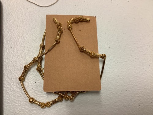 Gold colored necklace