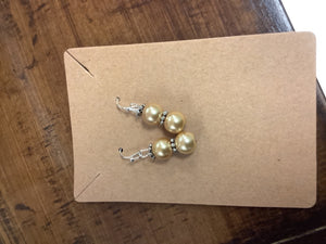 Mini gold/silver earrings.